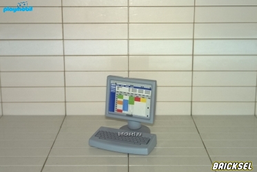 Компьютер с цветными таблицами на мониторе серый
